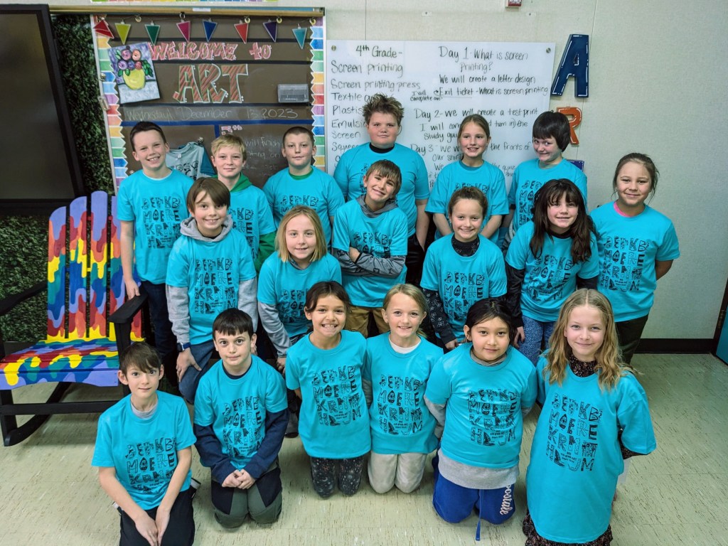 A group photo of children wearing their matching artlink tshirts